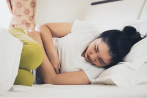 Child holding their stomach before school, illustrating functional abdominal pain in children